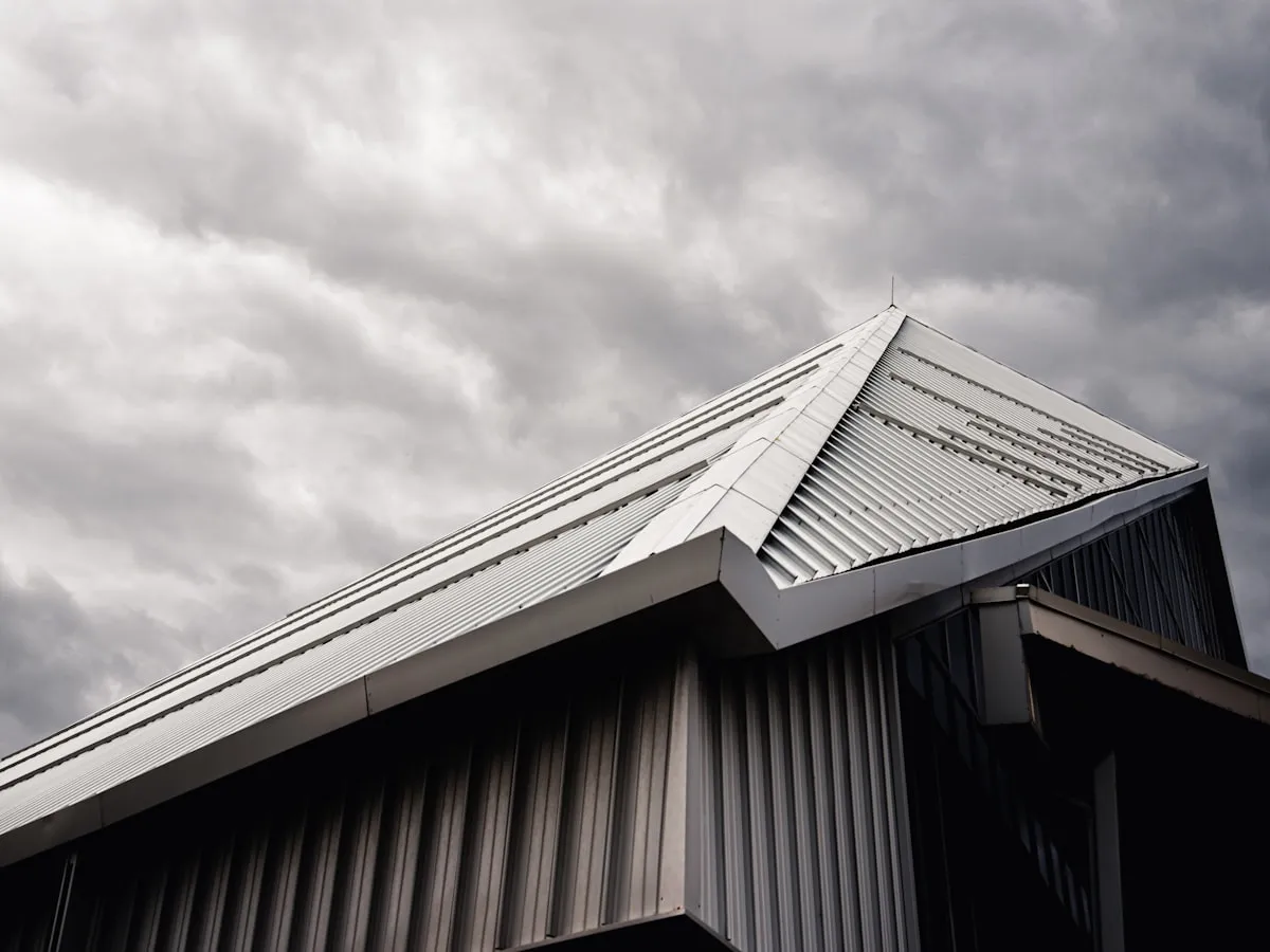 New charcoal standing-seam metal roof with crisp panel lines