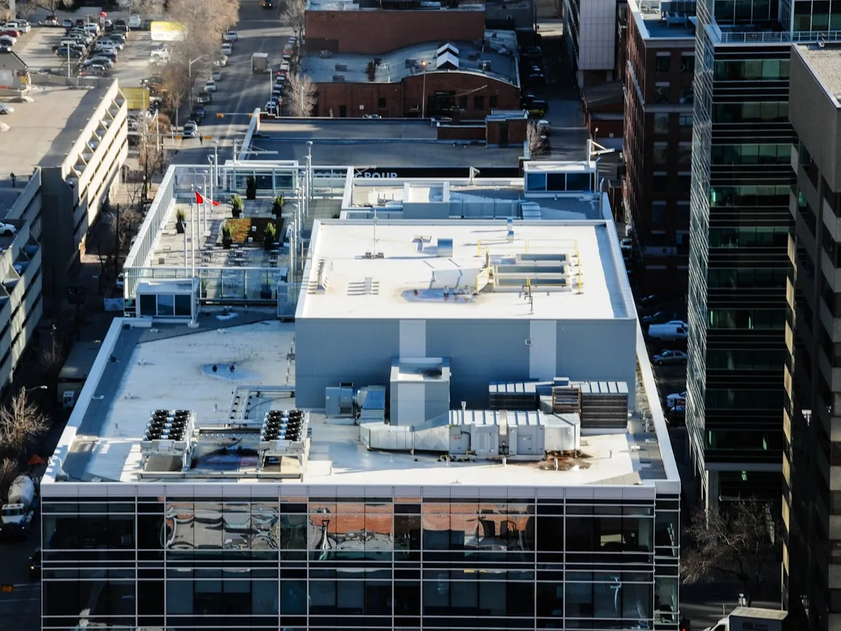 Clean white TPO membrane roof on a commercial office building